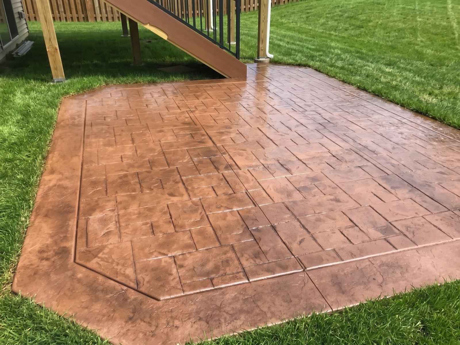 Colored Stamped Patio Under the Deck