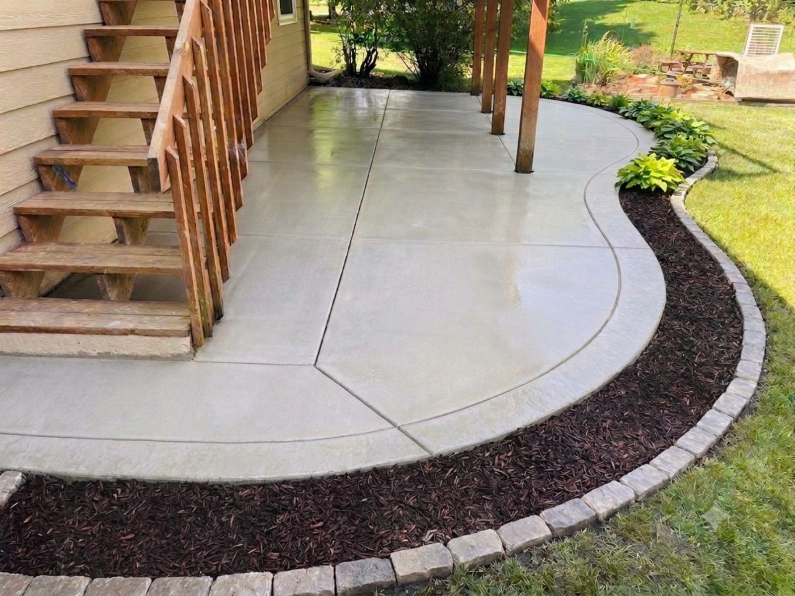 Curved Patio Under the Stairs